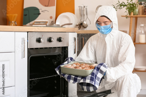 Woman in biohazard suit coo...