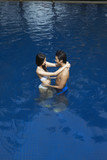 Couple embracing in pool