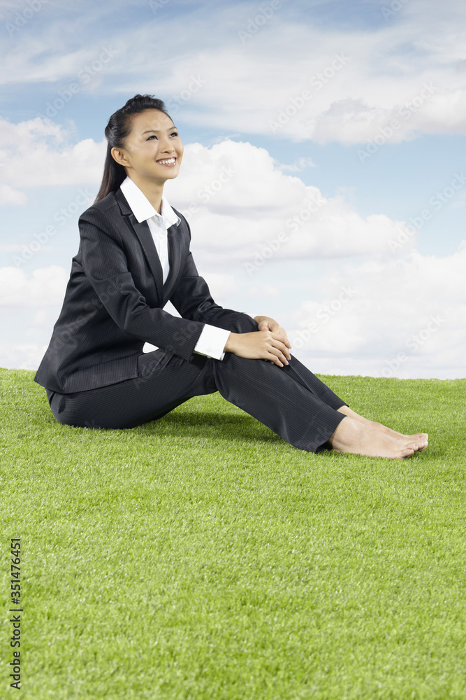 Young Asian businesswoman relaxing outdoors Young Asian businesswoman relaxing outdoors