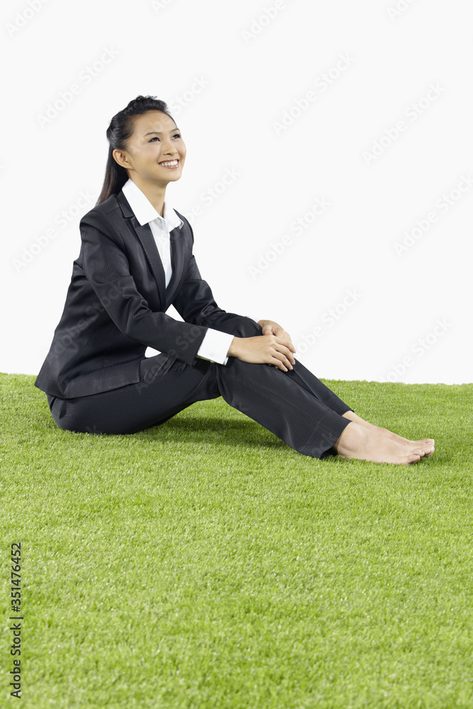 Young Asian businesswoman relaxing outdoors Young Asian businesswoman relaxing outdoors