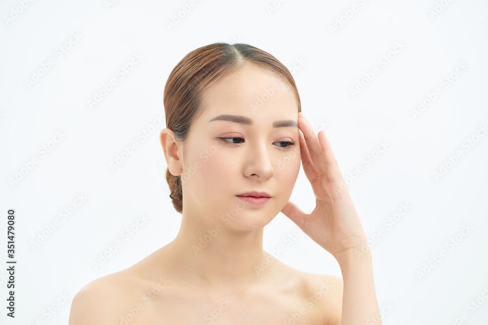 Portrait of tired and upset Asian woman over white background