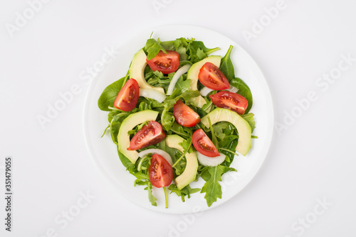 Eating clean concept. Top above overhead close-up view photo of a salad with olive oil plate placed in the center isolated on white background