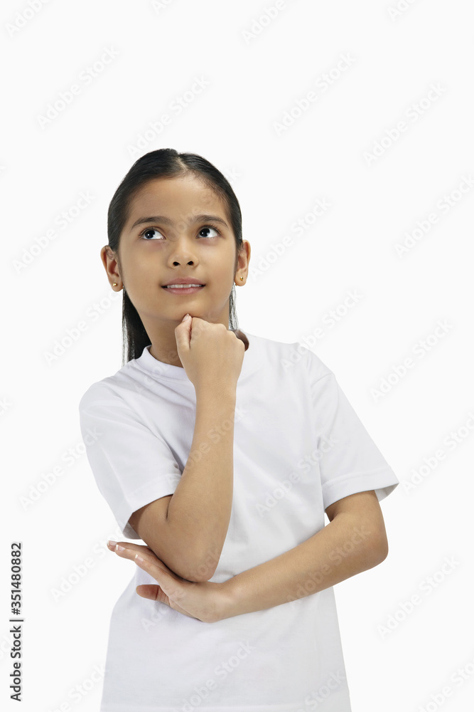 Girl contemplating with hand on chin
