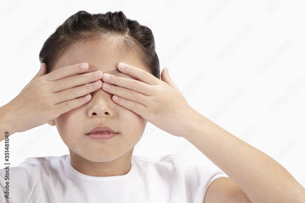 Girl covering her eyes with her hands