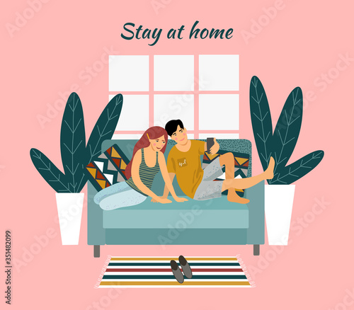 Stay home. A young couple sitting on a sofa and taking selfies on a pink background. Vector flat illustration.