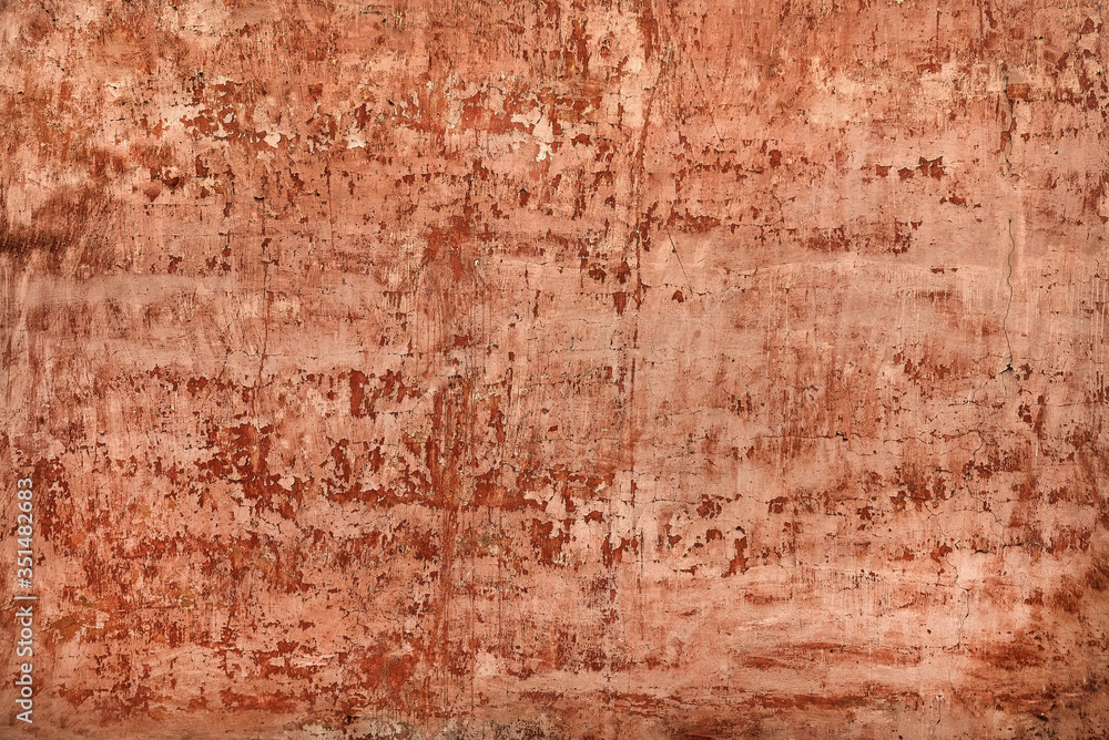 Obraz premium shabby red stucco with cracks and flakes of paint