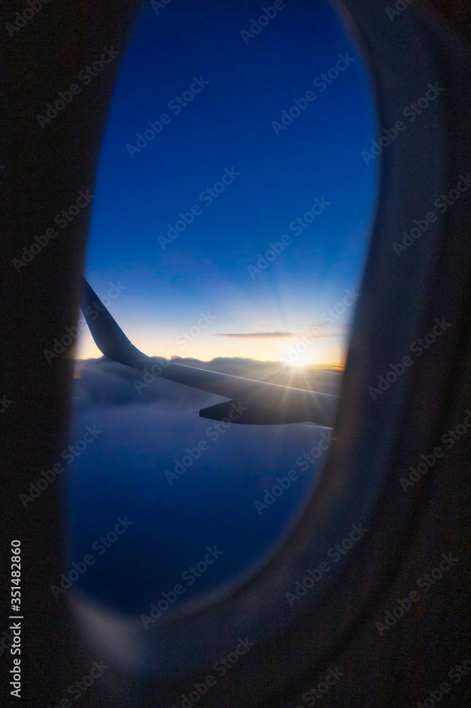 Fototapeta premium Window view from an aircraft at sunrise