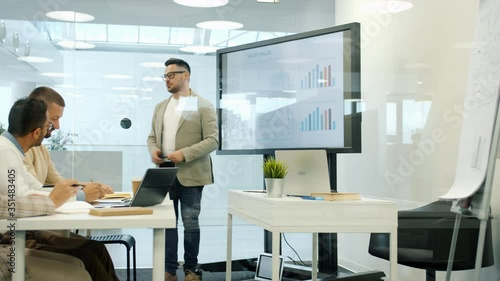 Wallpaper Mural Business expert speaking about marketing in office using digital whiteboard, group of people listening and learning. Modern technology and sales concept. Torontodigital.ca