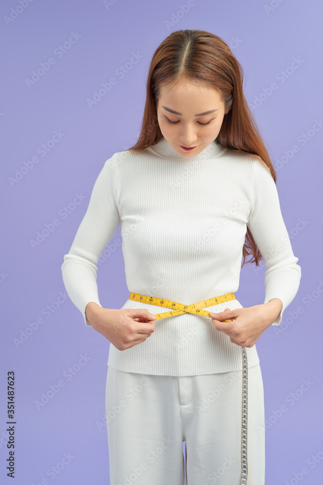 diet, sport and heath concept - beautiful sporty woman with measuring tape diet, sport and heath concept - beautiful sporty woman with measuring tape