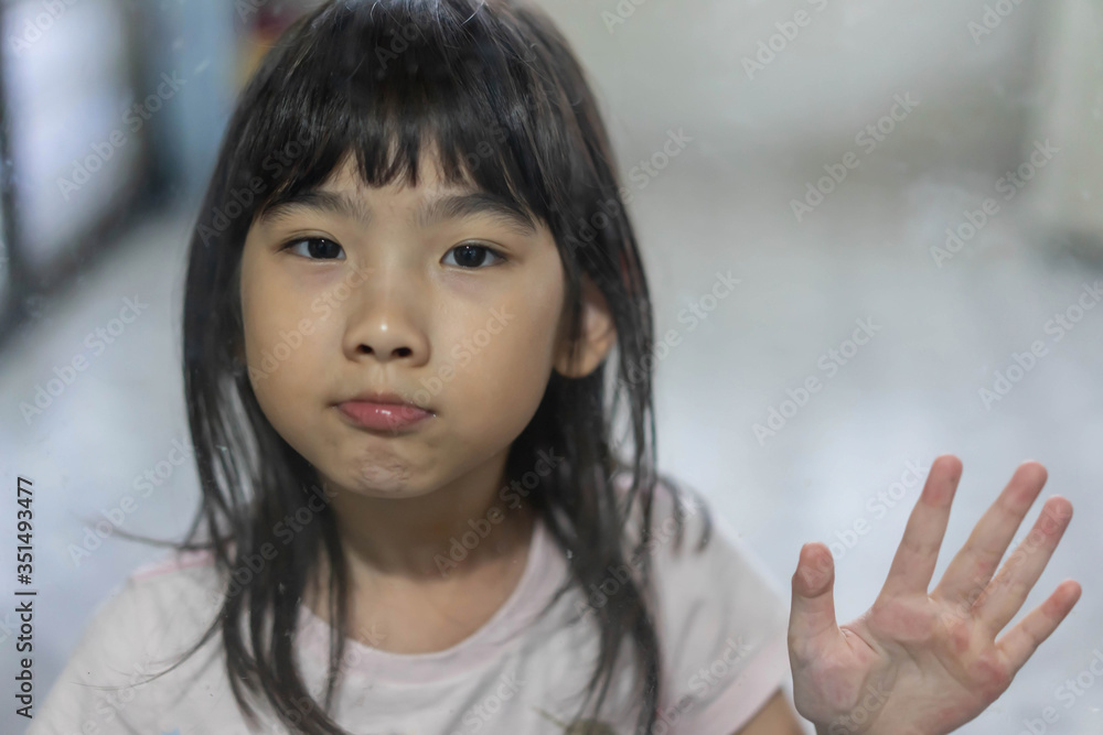 Portrait Asian cute child girl 7 years old Through the glass Portrait Asian cute child girl 7 years old Through the glass