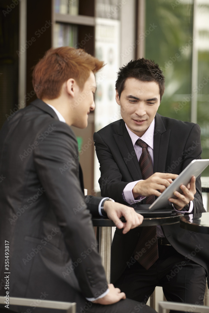 Businessmen having a discussion Businessmen having a discussion
