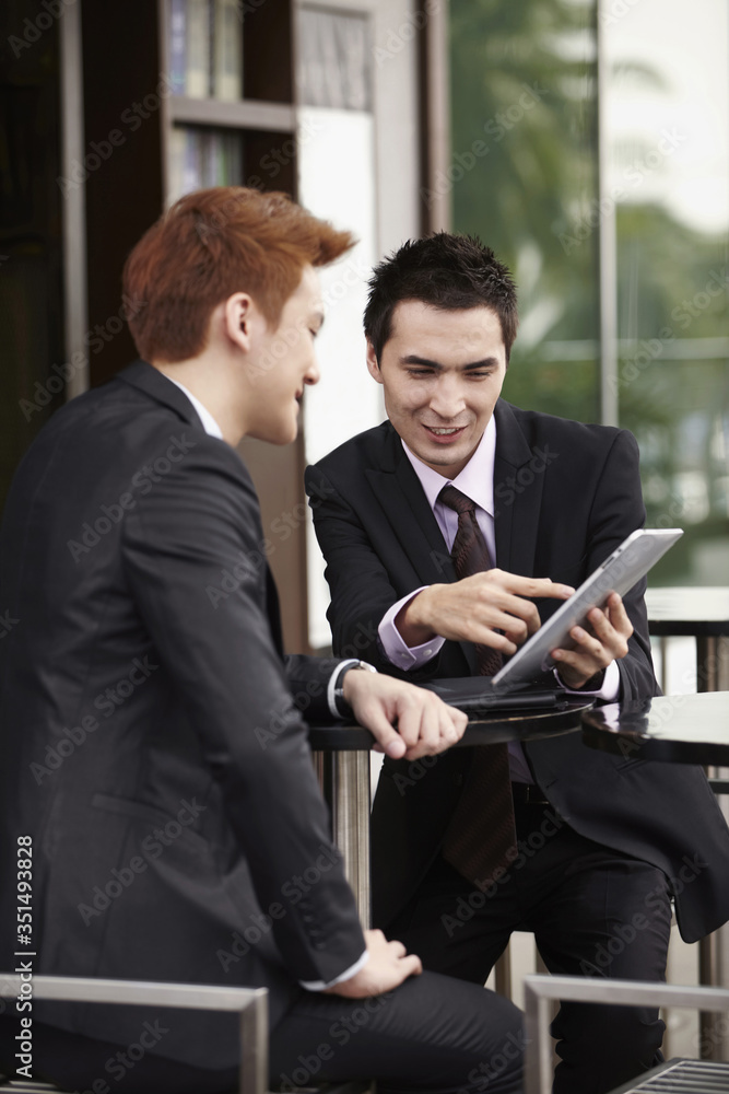 Businessmen having a discussion Businessmen having a discussion