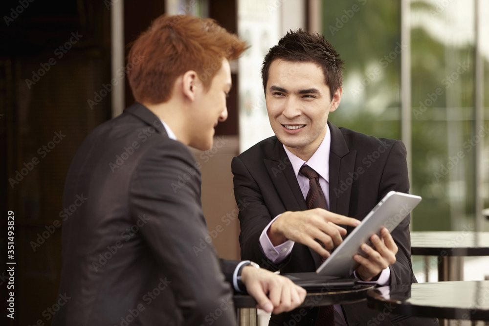 Businessmen having a discussion Businessmen having a discussion