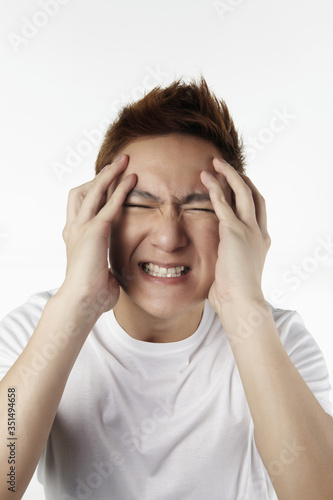 Man having headache © ImageHit