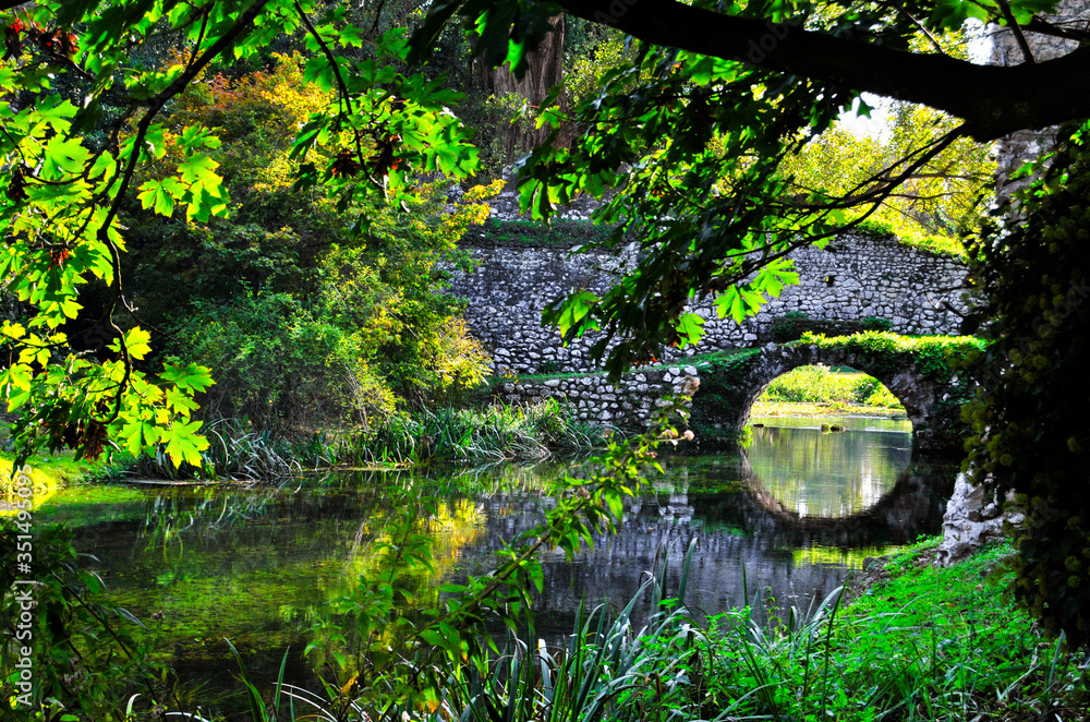 Garden of ninfa: detail of ancient stone bridge. Garden of ninfa: detail of ancient stone bridge.