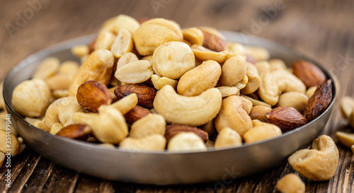 Portion of roasted nuts (close up; selective focus)