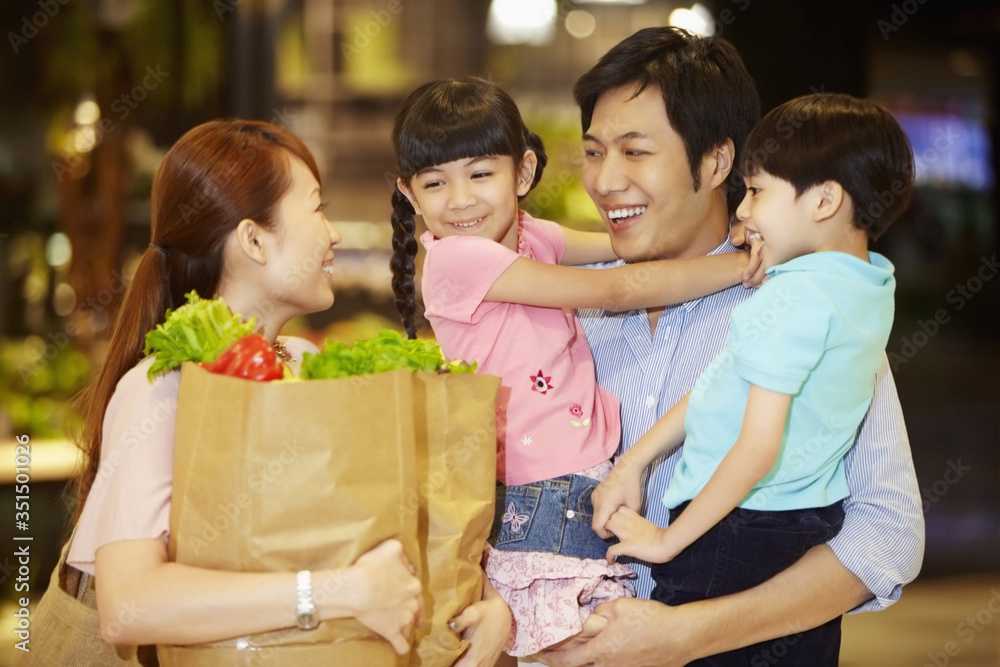 Family shopping for groceries together Family shopping for groceries together
