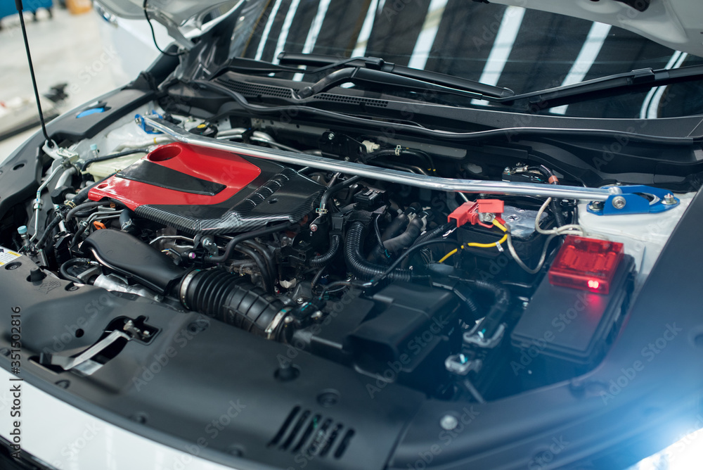 Close up detail of new car engine.,Open the hood to show the new engine Close up detail of new car engine.,Open the hood to show the new engine
