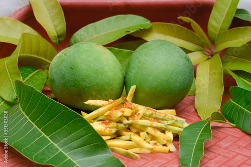 Raw mango and green leaf chilli powder and salt,   raw mango is very testy and also beneficial. photo