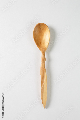 Wooden spoon on a white background