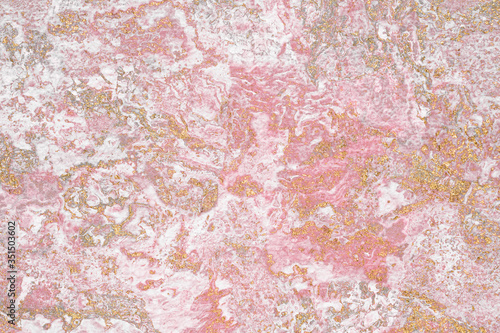 Grunge gold glitter on a pink textured background © rawpixel.com