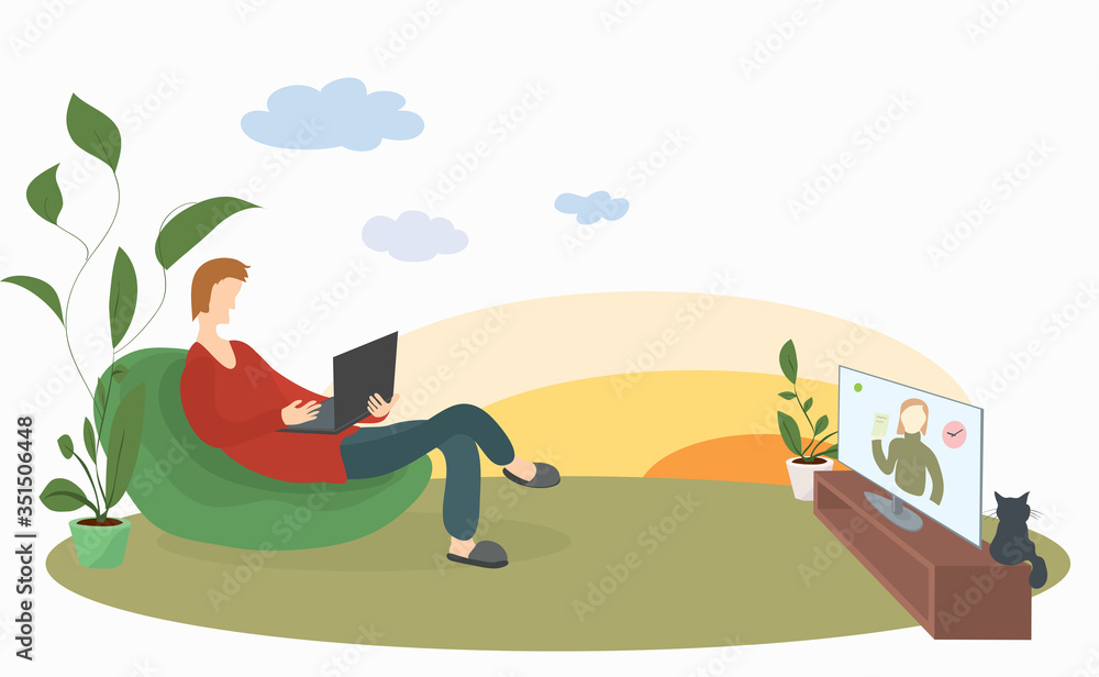 man with a laptop in a soft chair on the lawn conveniently watches news on TV. remote work and outdoor recreation