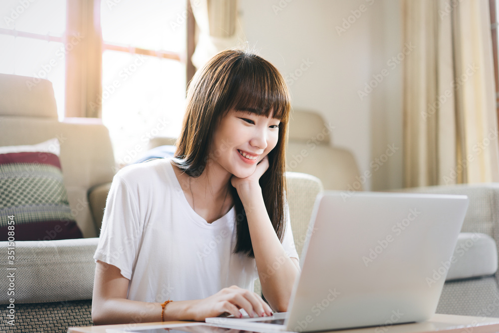 College teenager asian student study online stay at home via internet. College teenager asian student study online stay at home via internet.