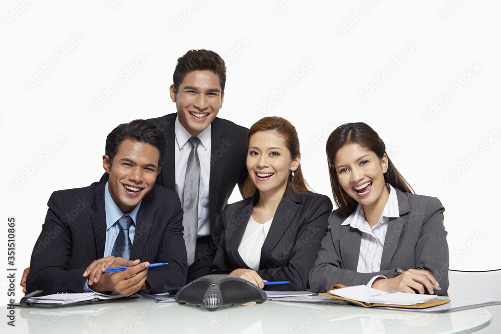 Businessmen and businesswomen having a teleconference call Businessmen and businesswomen having a teleconference call
