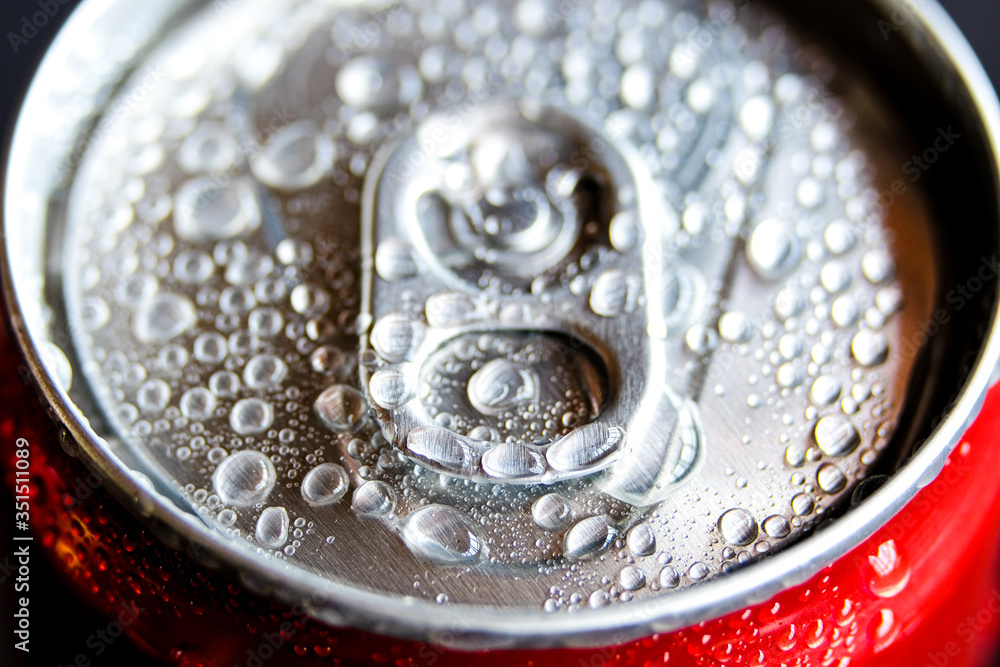 Macro photography of cold popular can drink full of water condensed during hot day.