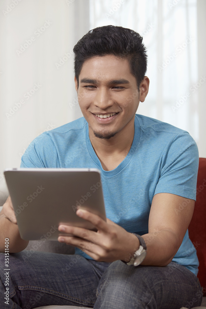 Man sitting and using digital tablet Man sitting and using digital tablet