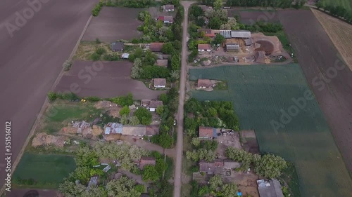 Village Houses and farmland aerial shot photo