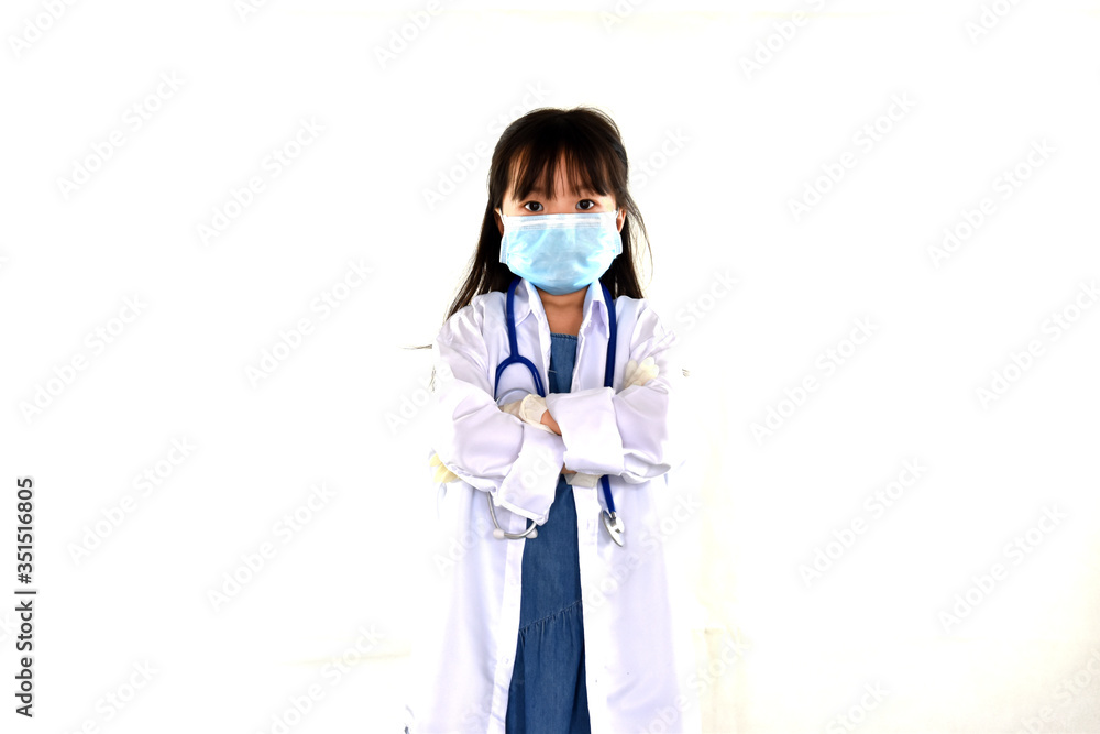 Child girl in a doctor coat with stethoscope, wearing gloves and Face mask on white background.