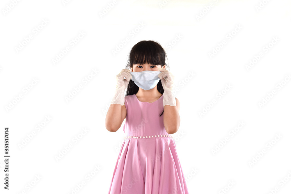 Child girl wearing gloves and masks on a white background. Prevent protection from infection covid-19 or coronavirus. Child girl wearing gloves and masks on a white background. Prevent protection from infection covid-19 or coronavirus.