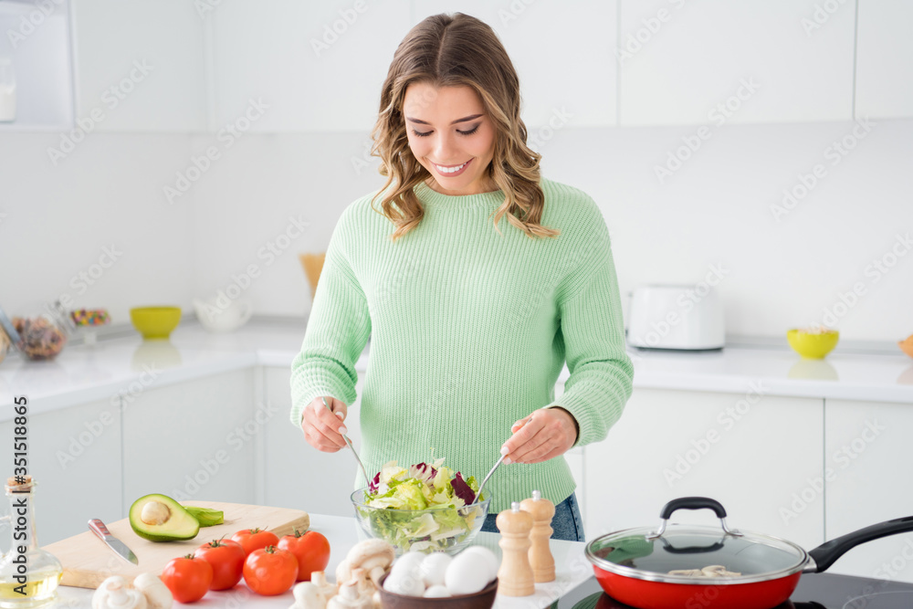 Portrait of her she nice attractive charming focused cheerful cheery wavy-haired girl making domestic delicious lunch hobby workshop in modern light white kitchen house indoors Portrait of her she nice attractive charming focused cheerful cheery wavy-haired girl making domestic delicious lunch hobby workshop in modern light white kitchen house indoors