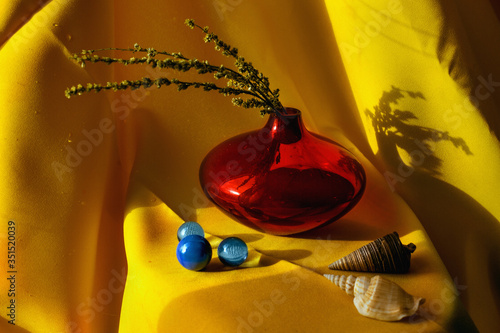 Still life red vase on a yellow background