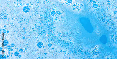 Slika na platnu soap bubble foam macro blue background