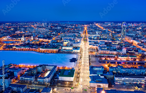 Main avenue of Yekaterinburg is Lenin Street. Plotinka. City lights are lit. Russia photo