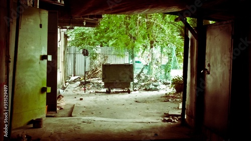 Big black container bin on wheels on the ground