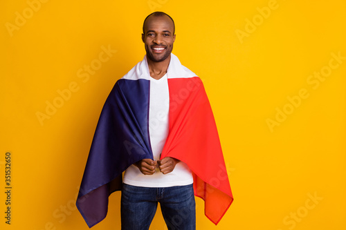 Portrait of positive afro american guy football lover support french nation league world cup game close cover t-shirt flag wear denim jeans isolated over bright shine color background