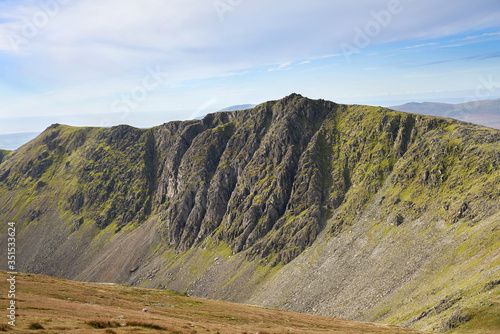 The summit of Dow Crag and Buck Pike from below Brim Fell on a sunny day in the Lake District. photo