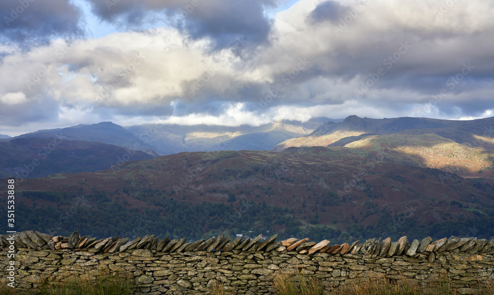 Fototapeta premium Silver How with distant views of Crinckle Crags in the cloud,Harison Stickle to the right and Pike of Blisco to the left in the Lake District.