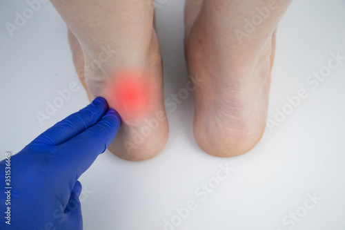 Photos An orthopedic doctor examines a woman's leg