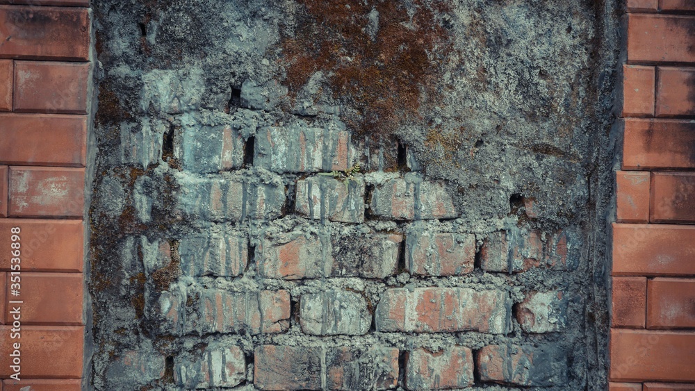 Old brick wall with new brick wall in between Old brick wall with new brick wall in between
