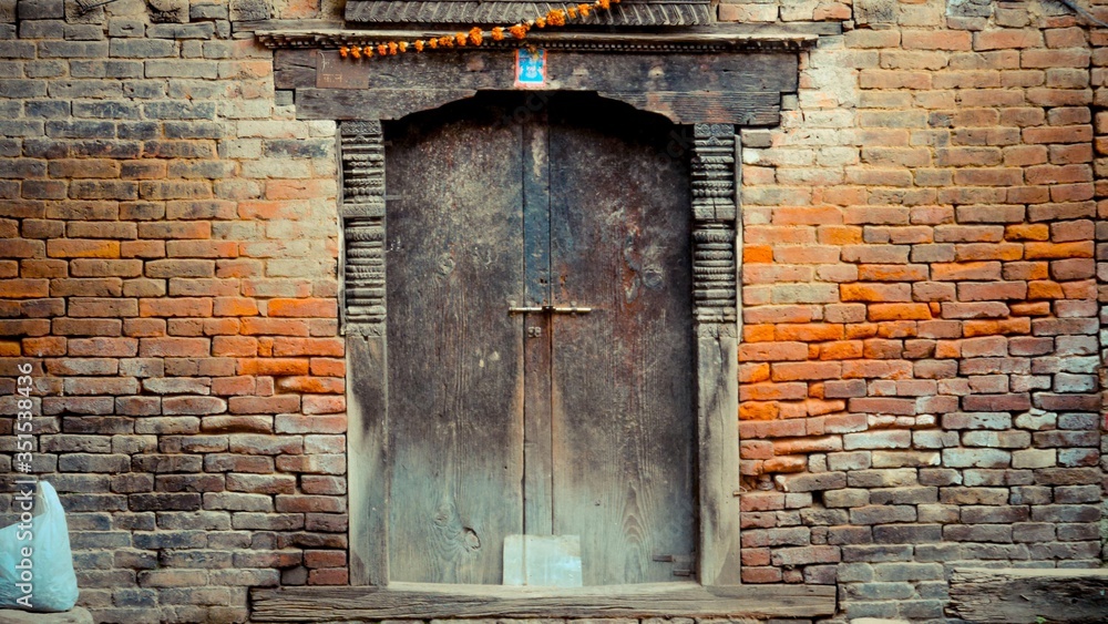 plastic bag with wooden door and brick walls plastic bag with wooden door and brick walls
