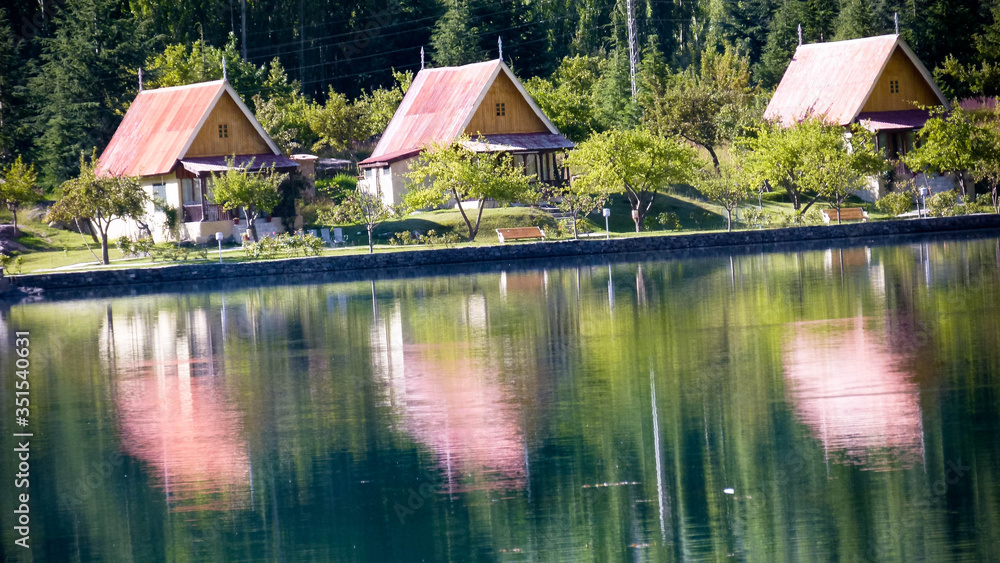 Rows of houses with reflection on the lake Rows of houses with reflection on the lake