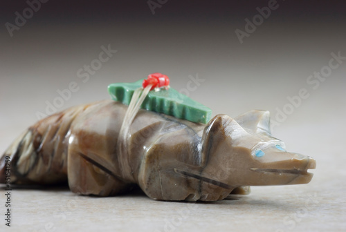 close up of a hand carved Zuni fetish animal. An american badger