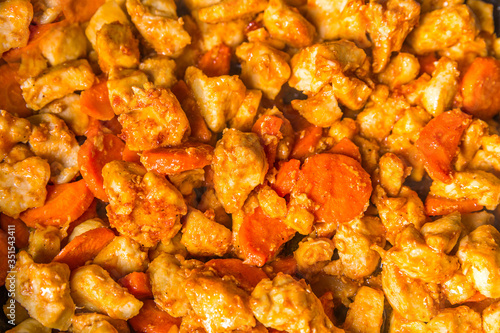 
Diced aromatic spicy fried chicken with carrots for a balanced diet.