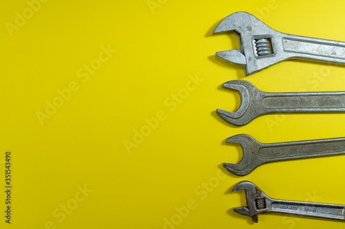 working tools. wrench for housework. colored background. tools for the house. steel reliable wand keys on a colored background. tools for manual worker