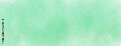 Fotografija Abstract Green Water color background on paper with spotted blank copy space