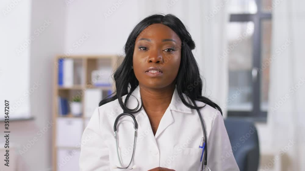 medicine, online service and healthcare concept - african american female doctor having online consultation at hospital medicine, online service and healthcare concept - african american female doctor having online consultation at hospital